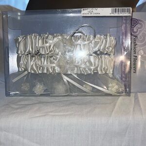 Two satin garter belts with flowers & pearls